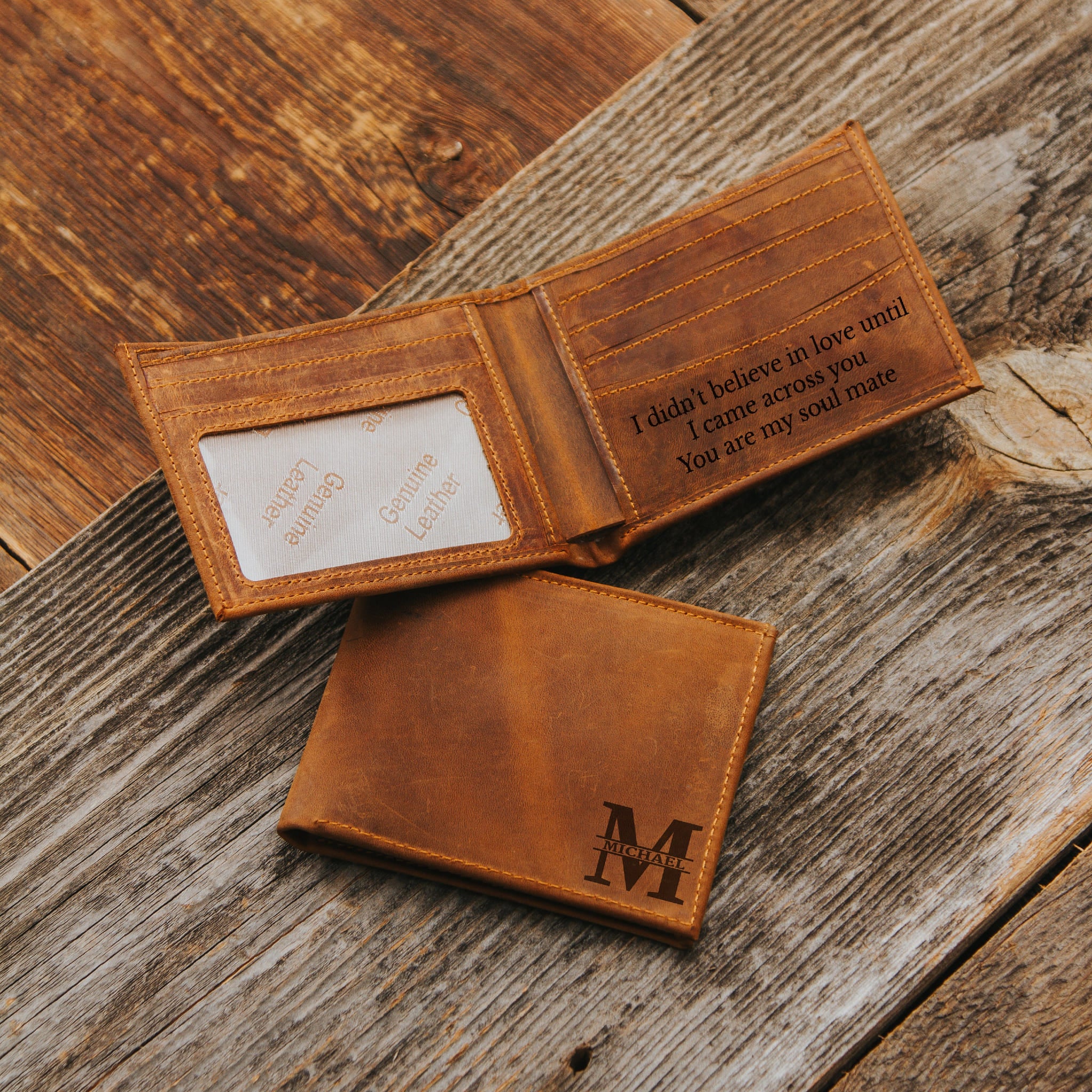 Light brown leather wallet with engraved text 