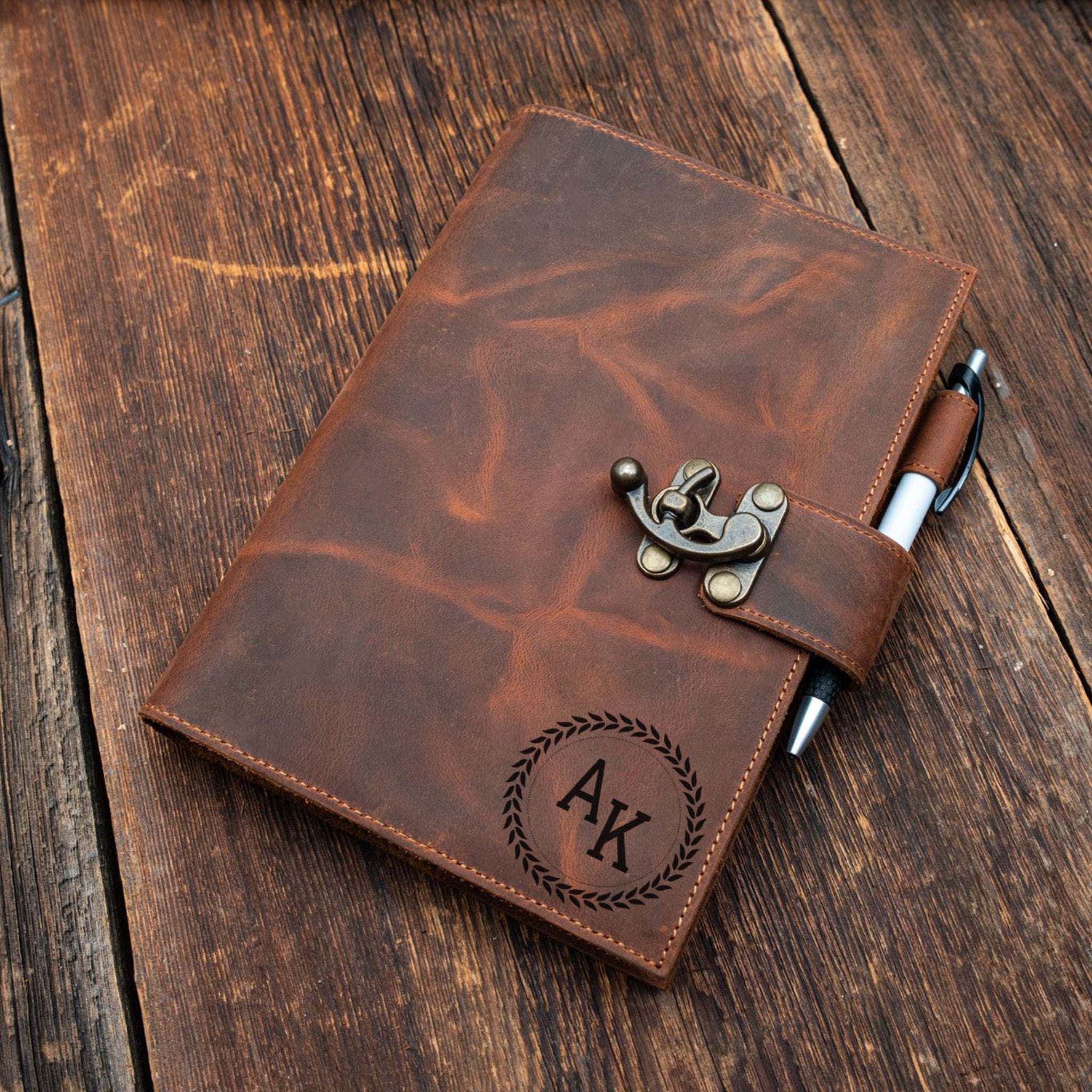 Brown leather notebook with pen holder