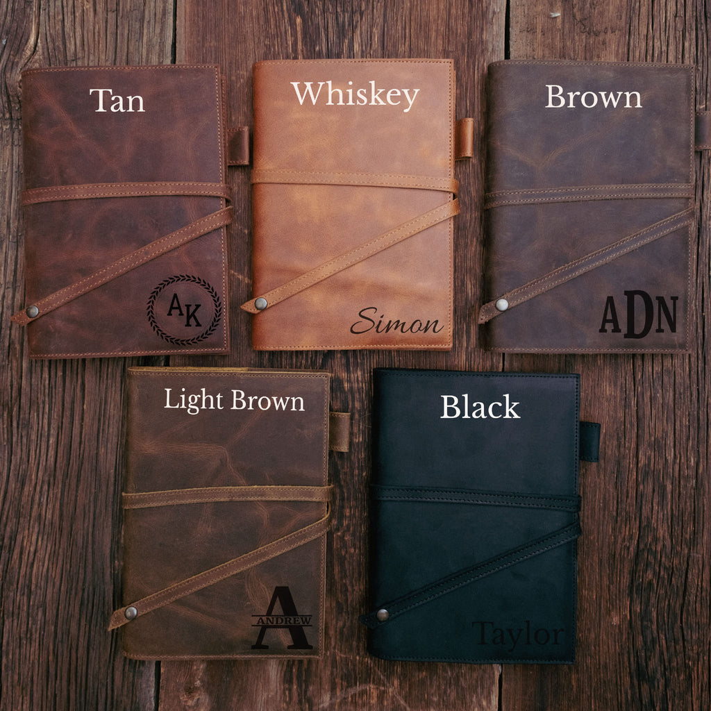 Collection of leather-bound notebooks in various colors 