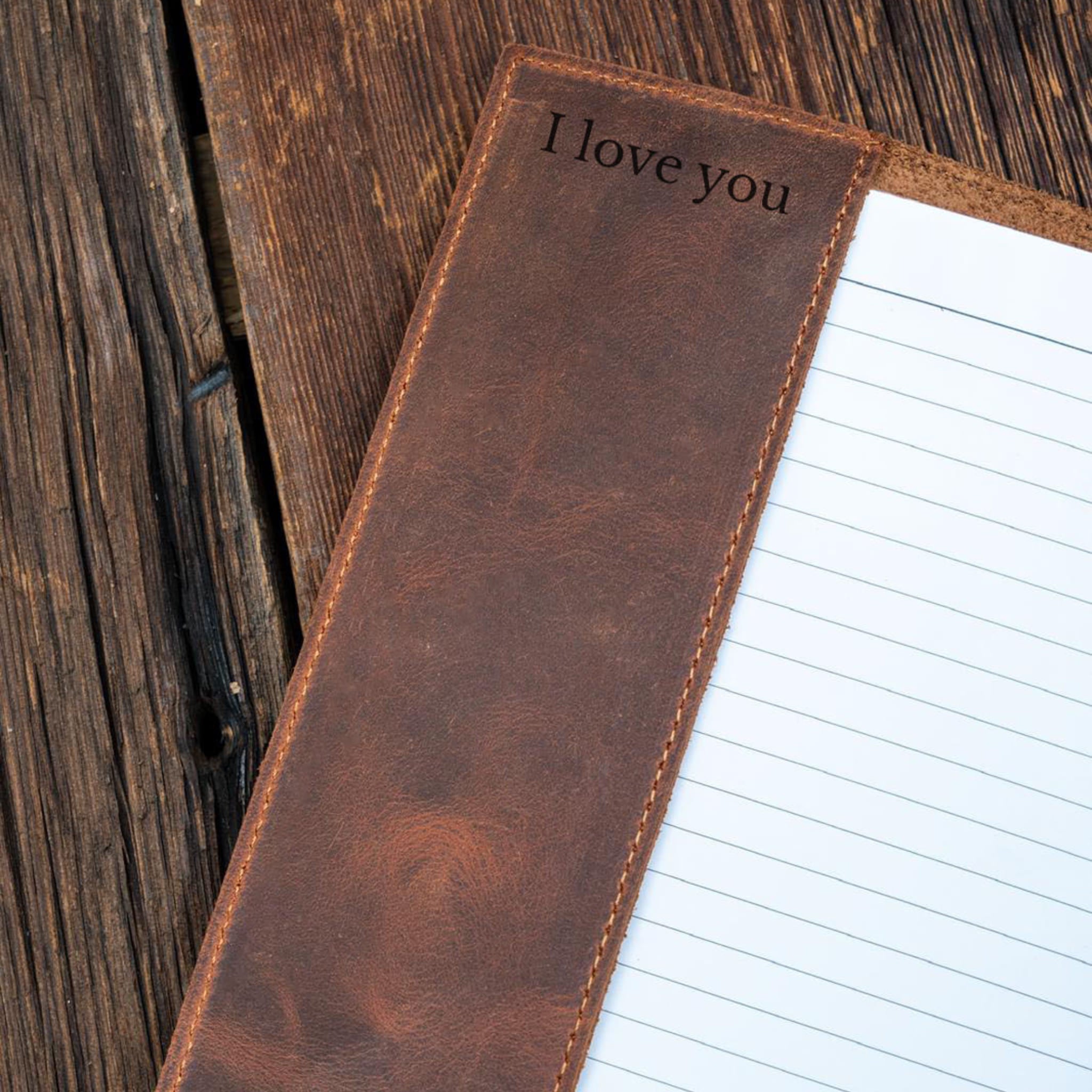 Brown leather notebook engraved
